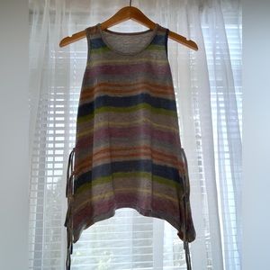 Disney stripped tank top with strapped details on the side.